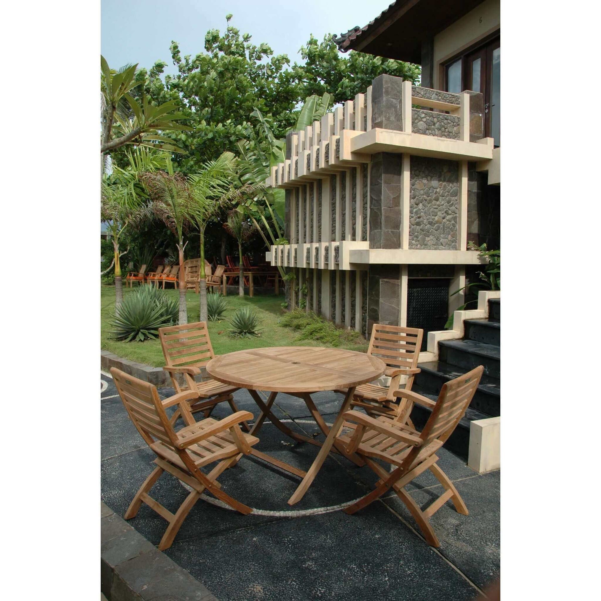 Anderson Teak Bahama Andrew 5-Pieces Folding Dining Set - Outdoor table and chairs outside of a building.